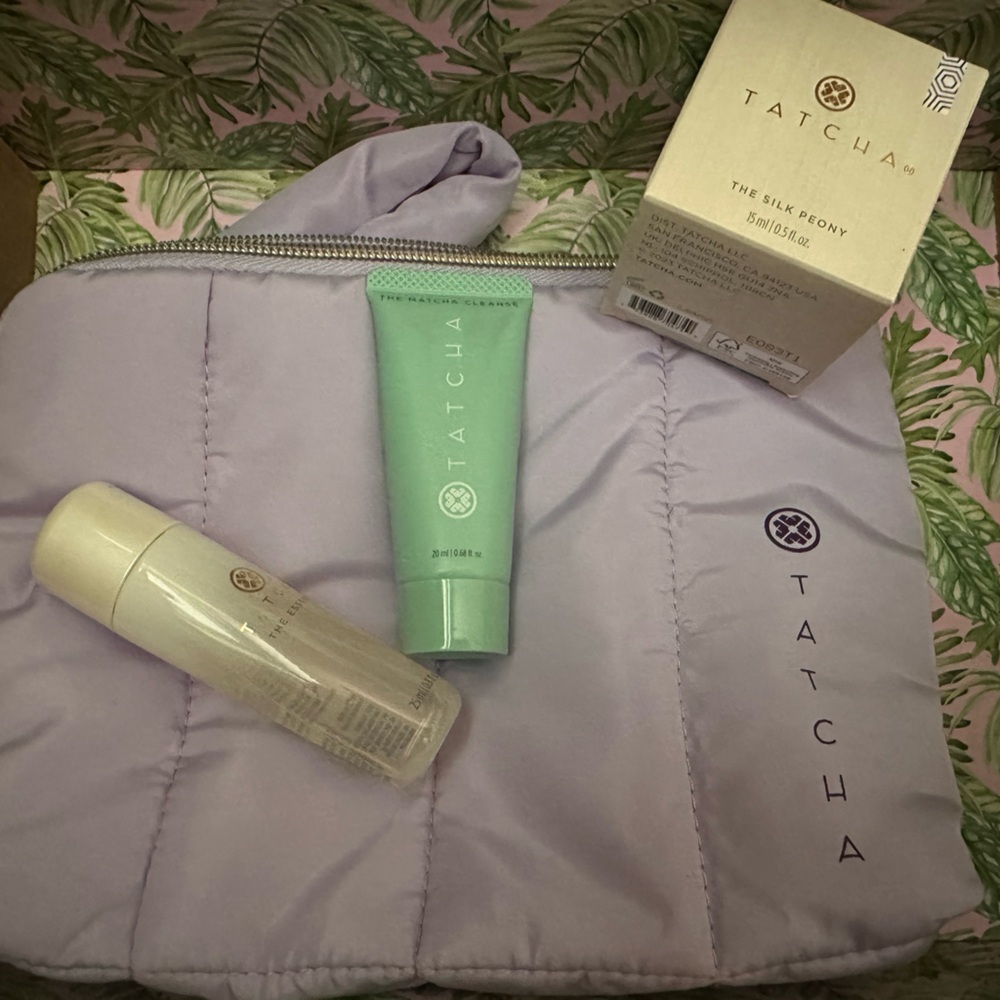 Tatcha The Silk Peony Cream, mini cleanser and essence, purple puffer bag
